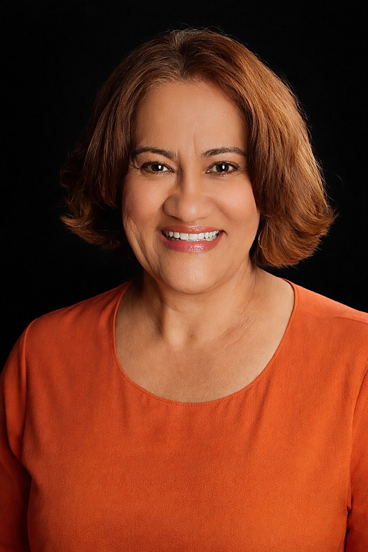 Portrait of Marta Villanueva against a dark background.